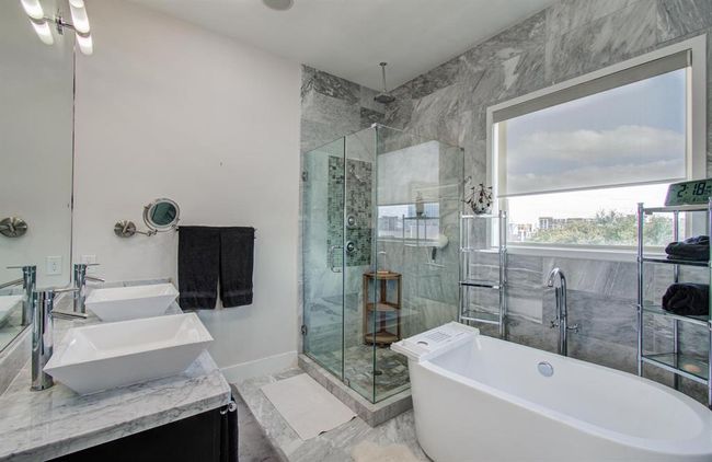 Check out this primary bathroom! Double sinks, separate soaking tub and walk in shower. | Image 27