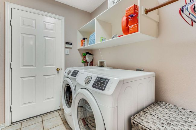 Laundry room for electric wash and dryer hook ups. Shelving. | Image 33