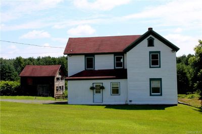 Back of house with a lawn | Image 3