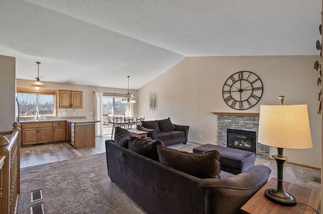 Vaulted ceilings, main floor living room, kitchen and informal dining room | Image 5