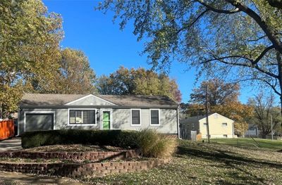 View of front of property with a garage and a front lawn | Image 2