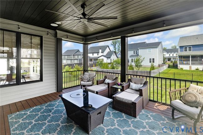 Sunroom with ceiling fan, healthy amount of natural light, and an outdoor living space | Image 41