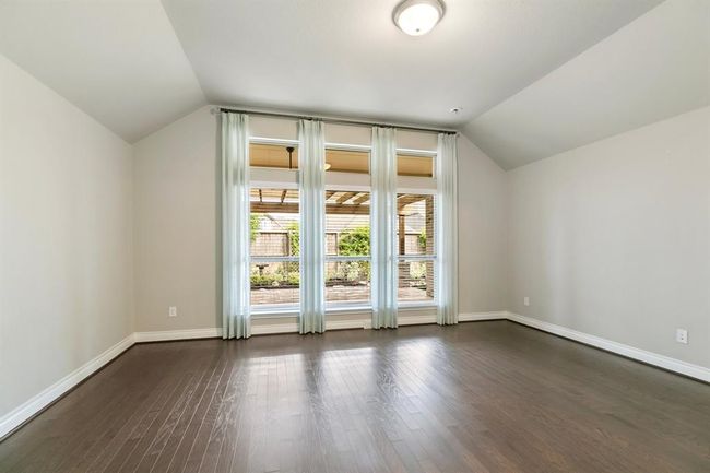 Primary Bedroom Looking from Bathroom and out to Covered Patio and Gazebo. | Image 15