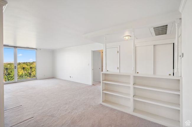 Unfurnished room with light carpet and ornamental molding | Image 4