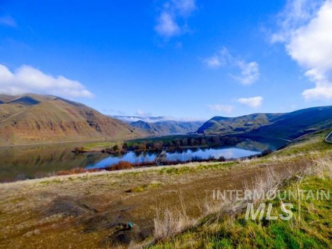 View of mountain background featuring a large body of water | Image 33