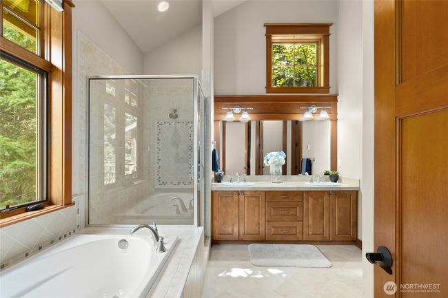 Spacious primary bath with soaking tub and walk in closet. | Image 17