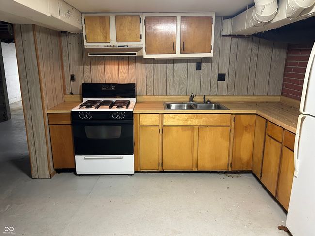 Basement kitchen for more cooking or canning (see canning room!). | Image 45