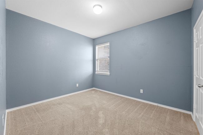 Carpeted spare room with baseboards | Image 33