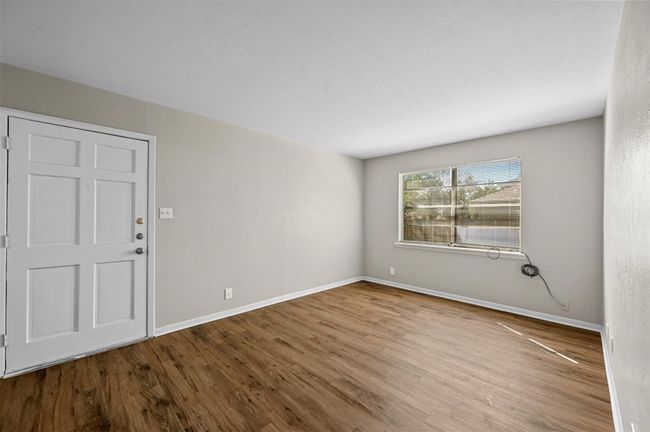 Entryway with wood finished floors and a textured ceiling | Image 10