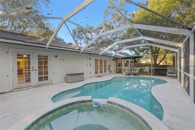 Enjoy the luxury of your own private screened-in pool and hot tub | Image 3