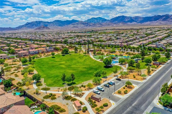 Aerial perspective of suburban area featuring a mountain backdrop | Image 60