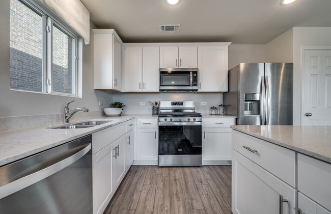 Kitchen featuring a large island ideal for informal dining and gatherings *Model representation | Image 10
