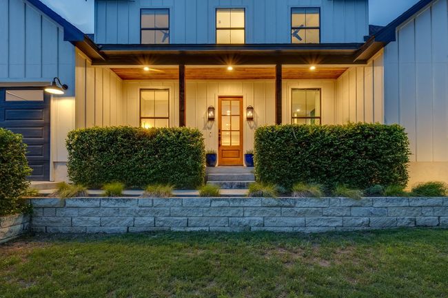 Welcoming front porch ideal for relaxing or greeting guests. | Image 7
