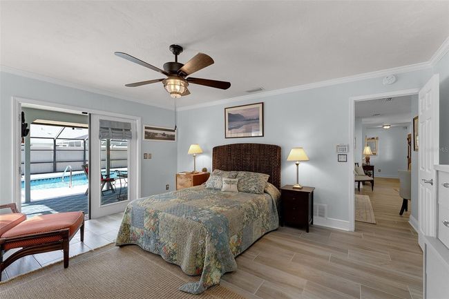 Primary Suite includes French Doors directly to the Lanai/Pool. | Image 18