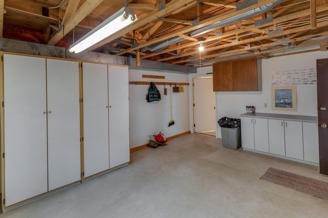 Lower level workshop with nice storage areas. | Image 38
