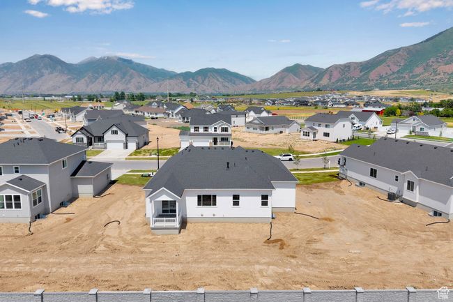Aerial perspective of suburban area featuring a mountain backdrop | Image 30