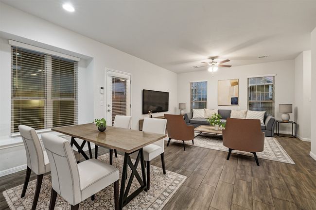 Dining area featuring visible vents, baseboards, dark wood-style floors, and a ceiling fan | Image 4