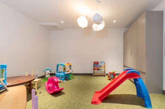 Rec room featuring carpet flooring, recessed lighting, a chandelier, and baseboards | Image 38