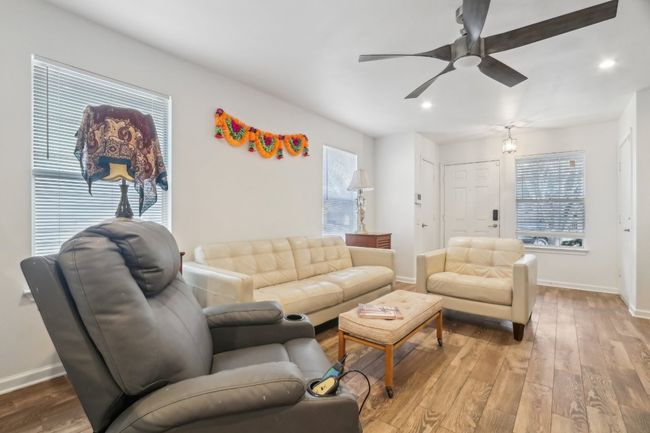 Living area with baseboards, recessed lighting, and a ceiling fan | Image 6