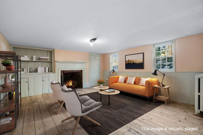 Lower level space, there are two rooms on the lower level and a bathroom, access from first floor or door entry from rear property. Virtual staged. | Image 16