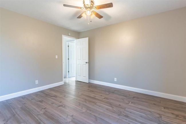 Spare room featuring ceiling fan and light hardwood / wood-style floors | Image 18