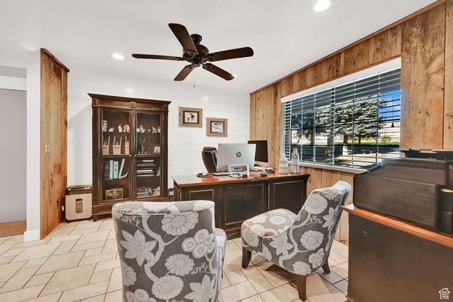Tiled office with wooden walls and ceiling fan | Image 14