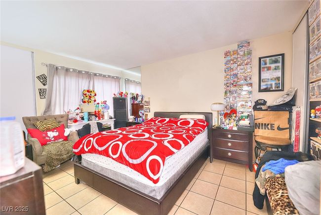 View primary bedroom with tile floors | Image 13