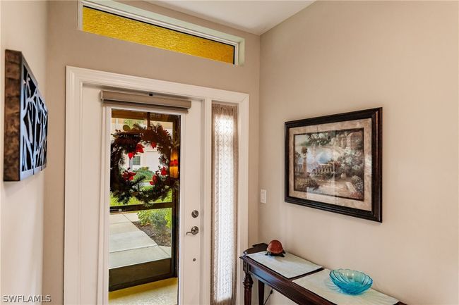 FOYER AS YOU ENTER THE HOME WITH SCREENED-IN ENTRYWAY! | Image 8