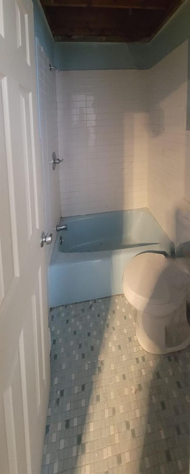 Bathroom featuring tile patterned floors, toilet, and bathing tub / shower combination | Image 26
