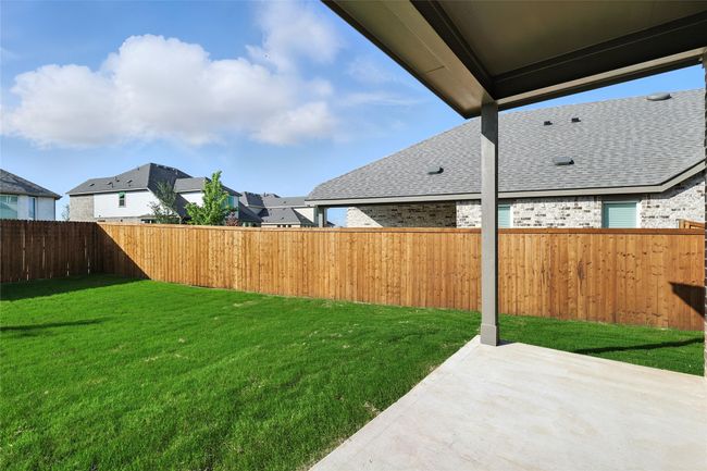Fenced backyard with a patio and a residential view | Image 27