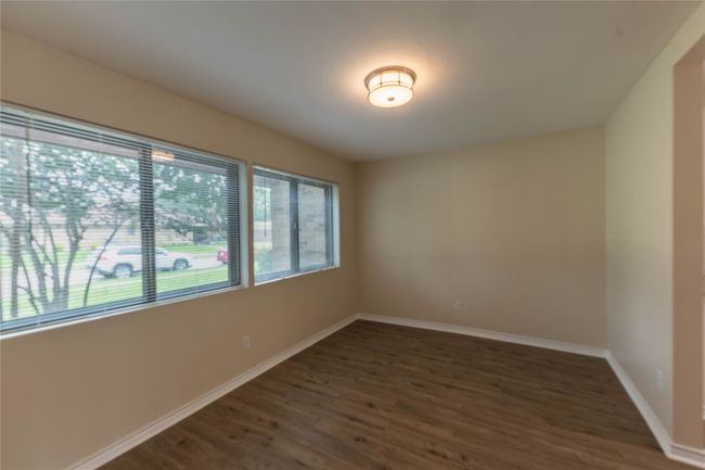 Empty room featuring wood finished floors and baseboards | Image 10