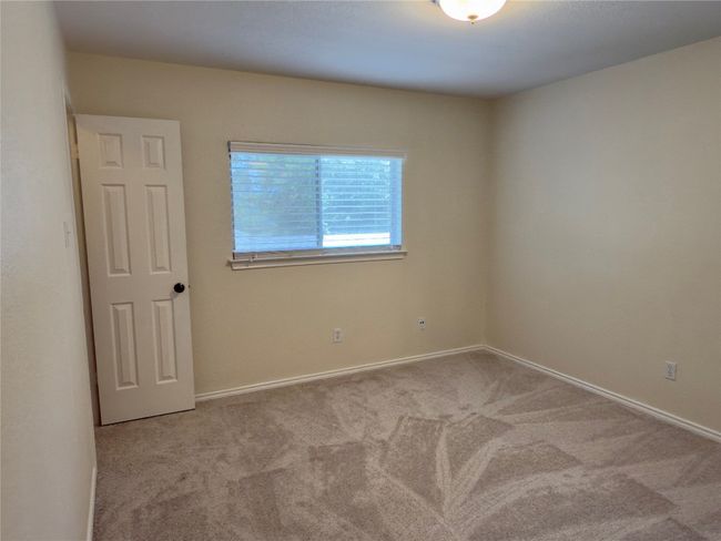Carpeted empty room with baseboards | Image 30