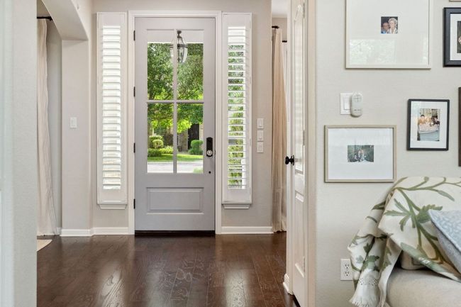The welcoming foyer is flanked by elegant formal living and dining rooms. | Image 13