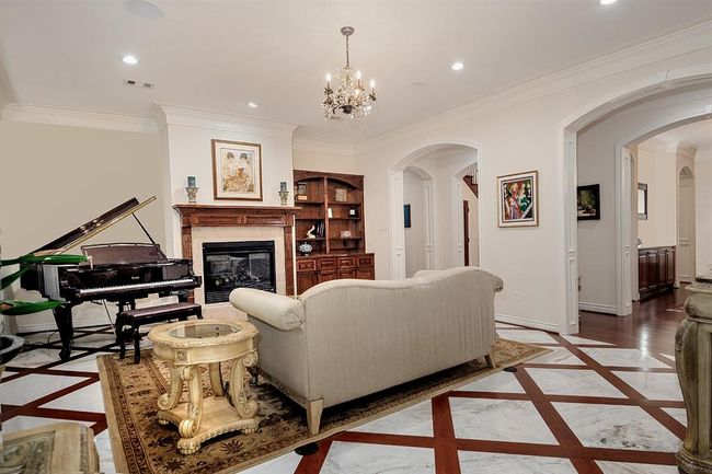 Another view of the formal living with stunning floors and built-ins | Image 11