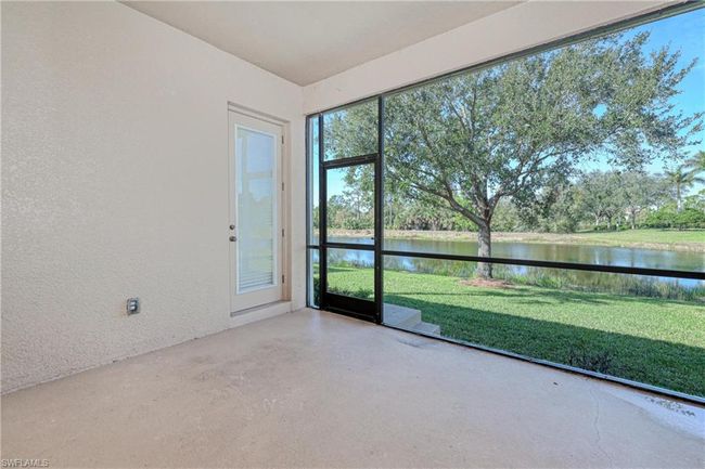 Unfurnished sunroom with a water view | Image 38
