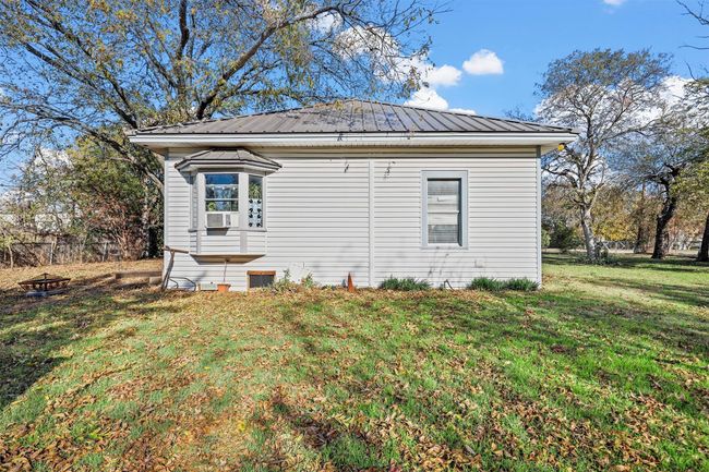 View of side of home featuring cooling unit and a lawn | Image 7