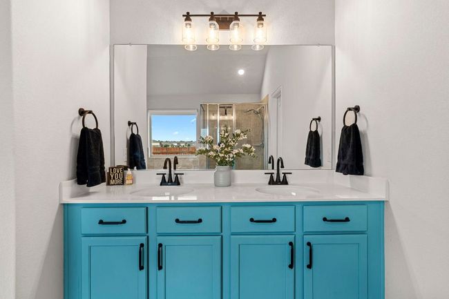 Full bath featuring double vanity and a stall shower | Image 24