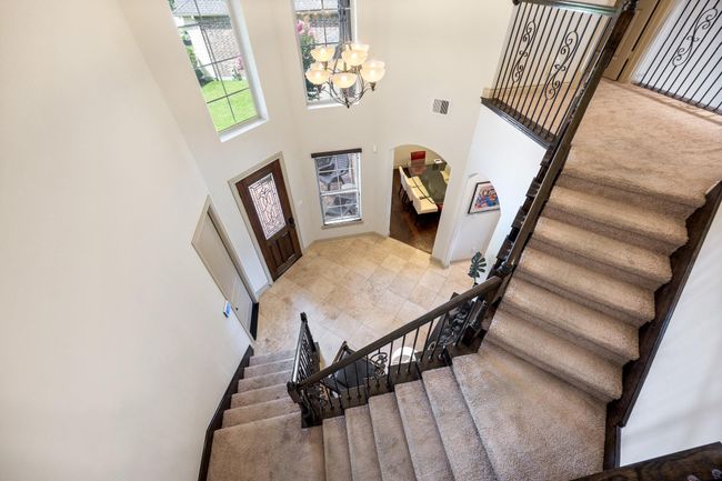 Let's make our way upstairs to the secondary bedrooms & game room. | Image 29