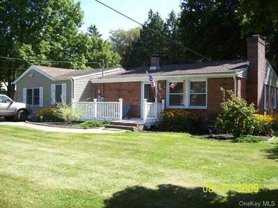 Single story home featuring a front yard | Image 1