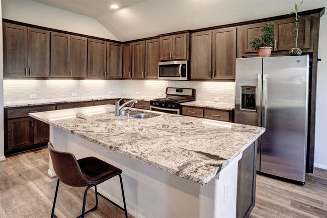 The stunning granite countertops leave a lasting impression. | Image 12