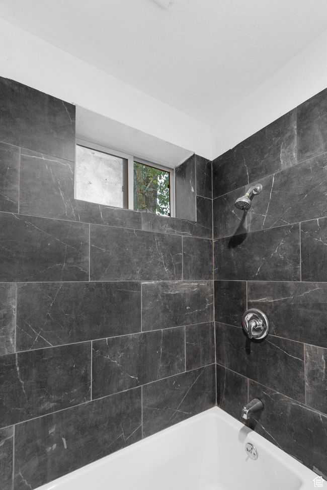 Full bathroom featuring shower / bath combination | Image 14