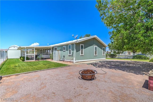 Back of house with a fire pit | Image 28