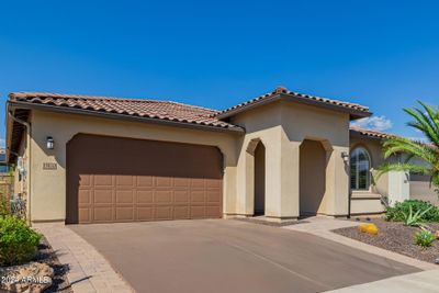 Stained concrete driveway with paver accents provide lovely curb appeal | Image 3