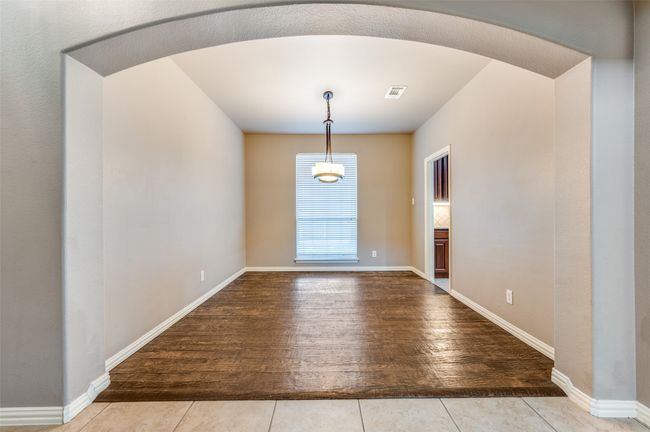 Formal dining area featuring handscraped wood finished floors | Image 4