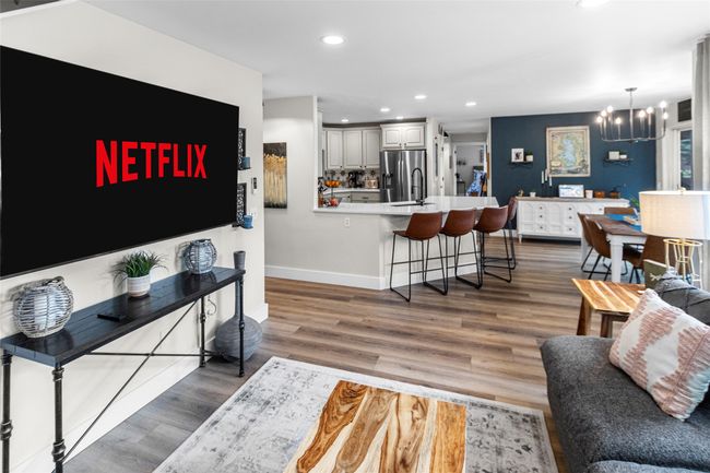 Living area featuring a chandelier, recessed lighting, and wood finished floors | Image 27