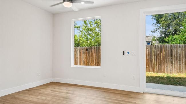 Unfurnished room featuring light wood-type flooring and ceiling fan | Image 17