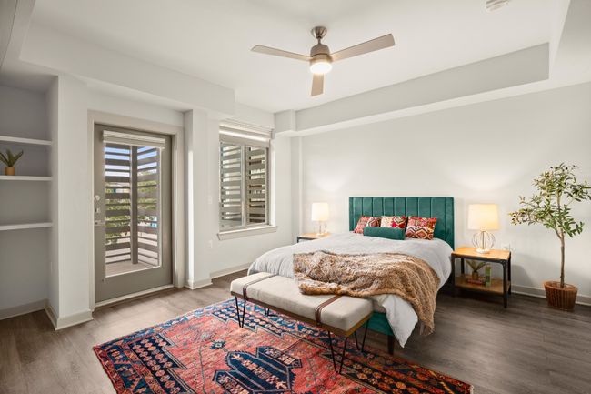Bedroom featuring access to outside, wood finished floors, baseboards, and a ceiling fan | Image 14