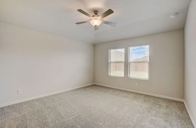 Spare room featuring light carpet and ceiling fan | Image 7