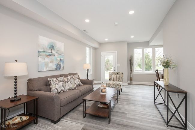 Living room with light hardwood / wood-style flooring | Image 9