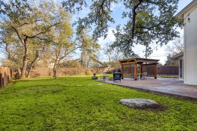 On warm evenings, imagine hosting a dinner party under the pergola, the evening air filled with laughter, the scent of grilling food, and the soft glow of patio lights creating the perfect ambiance | Image 28